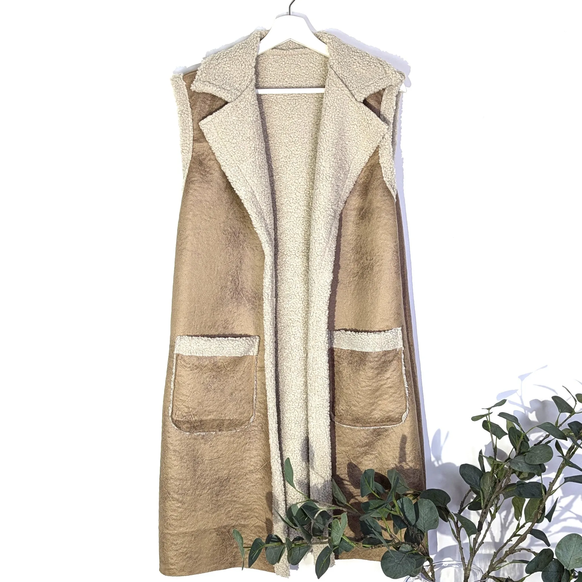Mid length sheep skin style gilet with lapels and patch pockets